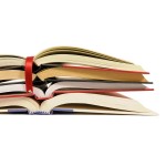 Small pile of open books with red bookmark ribbon isolated on white background